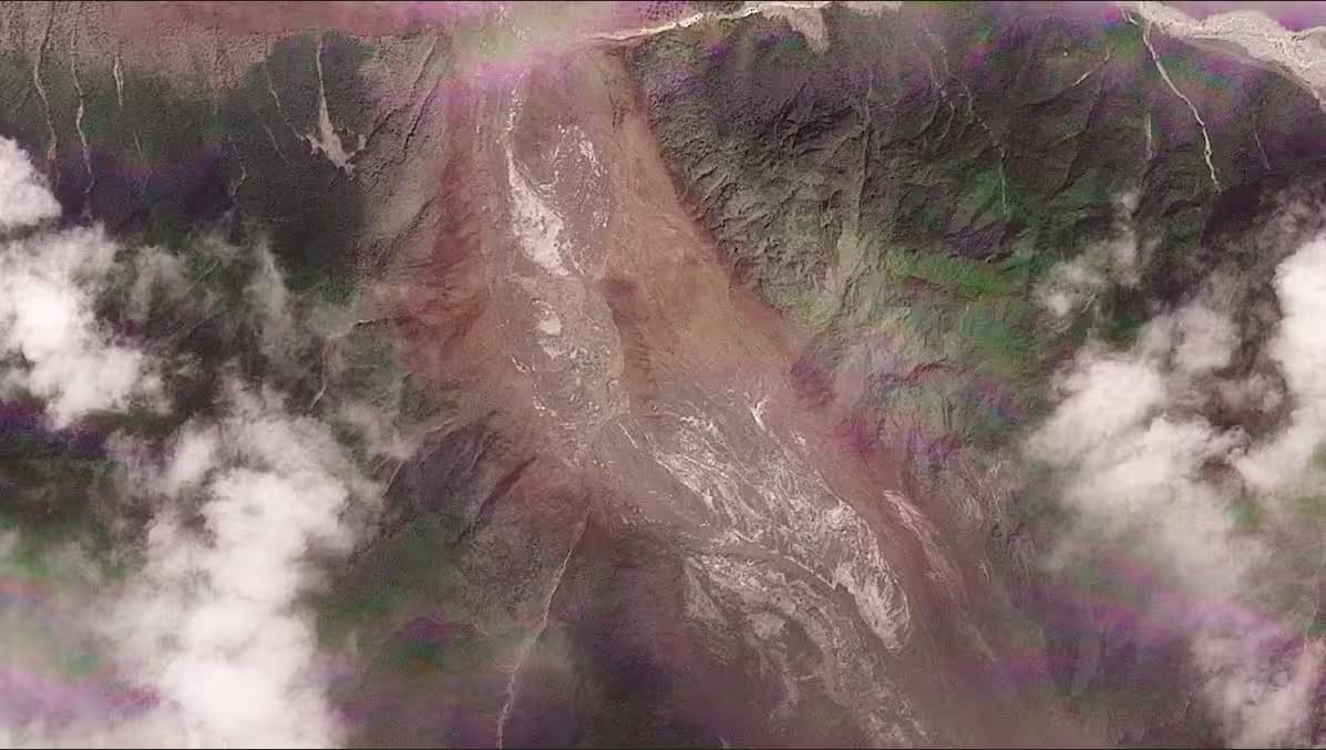 Satellite view of a steep mountainside covered by a large brown debris flow