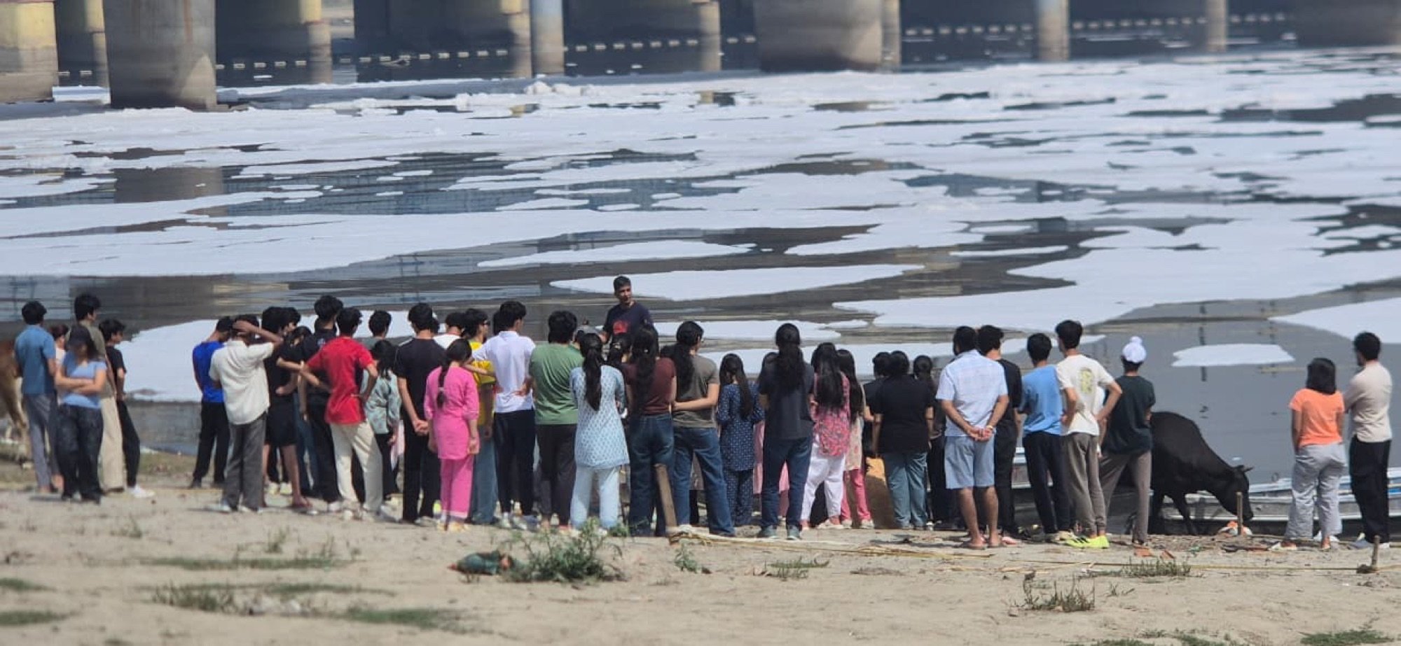 A crowd on the Yamuna floodplain looking out over the river