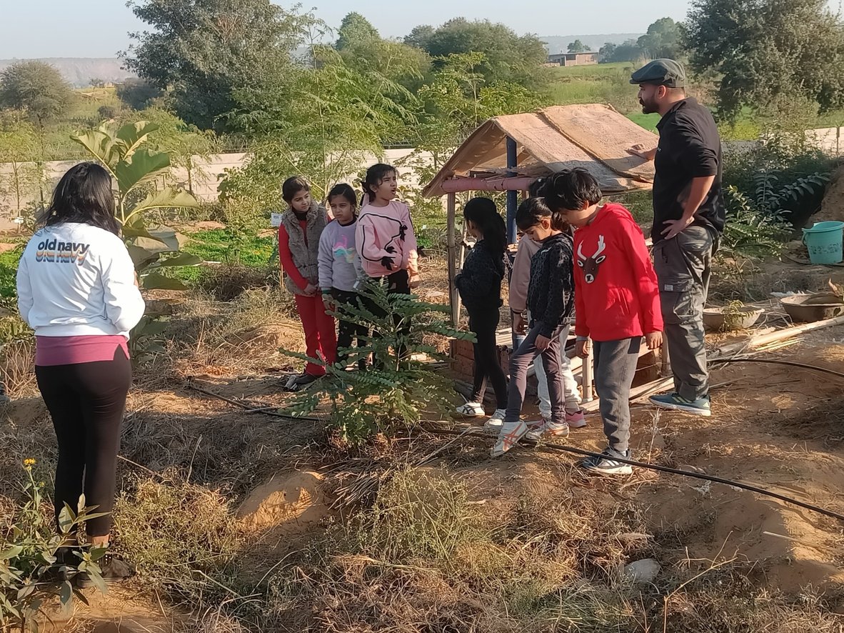 Young volunteers gathered at a planting site
