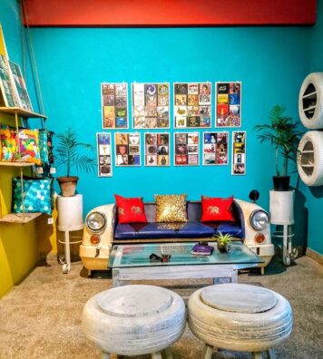 Upcylcled Furniture built from an old ambassador car, stools made from old tyres and decorative wall art created using CD frames and old wood {{brizy_dc_image_alt imageSrc=